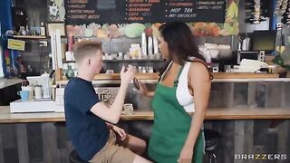 Girl with big boobs working as a barista in the coffee shop