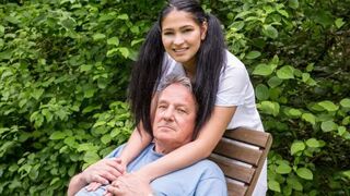 The man gently cares for his girlfriend in an intimate way