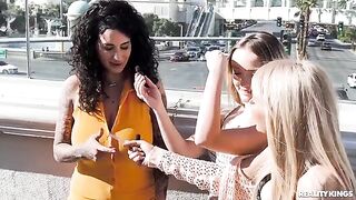 Two sexy lesbians are playing cards naked on the strip