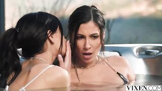 A brunette is having fun with her girlfriend in paradise