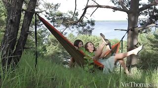 The lesbian beauties are having fun on a summer day in nature