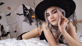 A cute witch in a purple robe waits for her magic lover