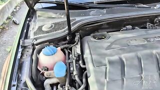 A girl is having fun with a stranger after a car breakdown