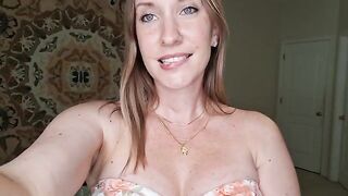 A woman with big tits has a breast massage with shimmering oil