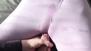A girl caresses her soaked pussy with her thumb in a steamy scene