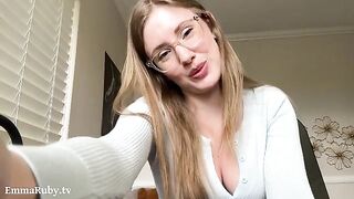 A girl with glasses gently caresses you through the sheets