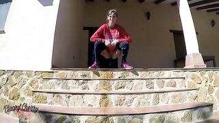 A woman with a full bladder plays with her pussy and pisses outside
